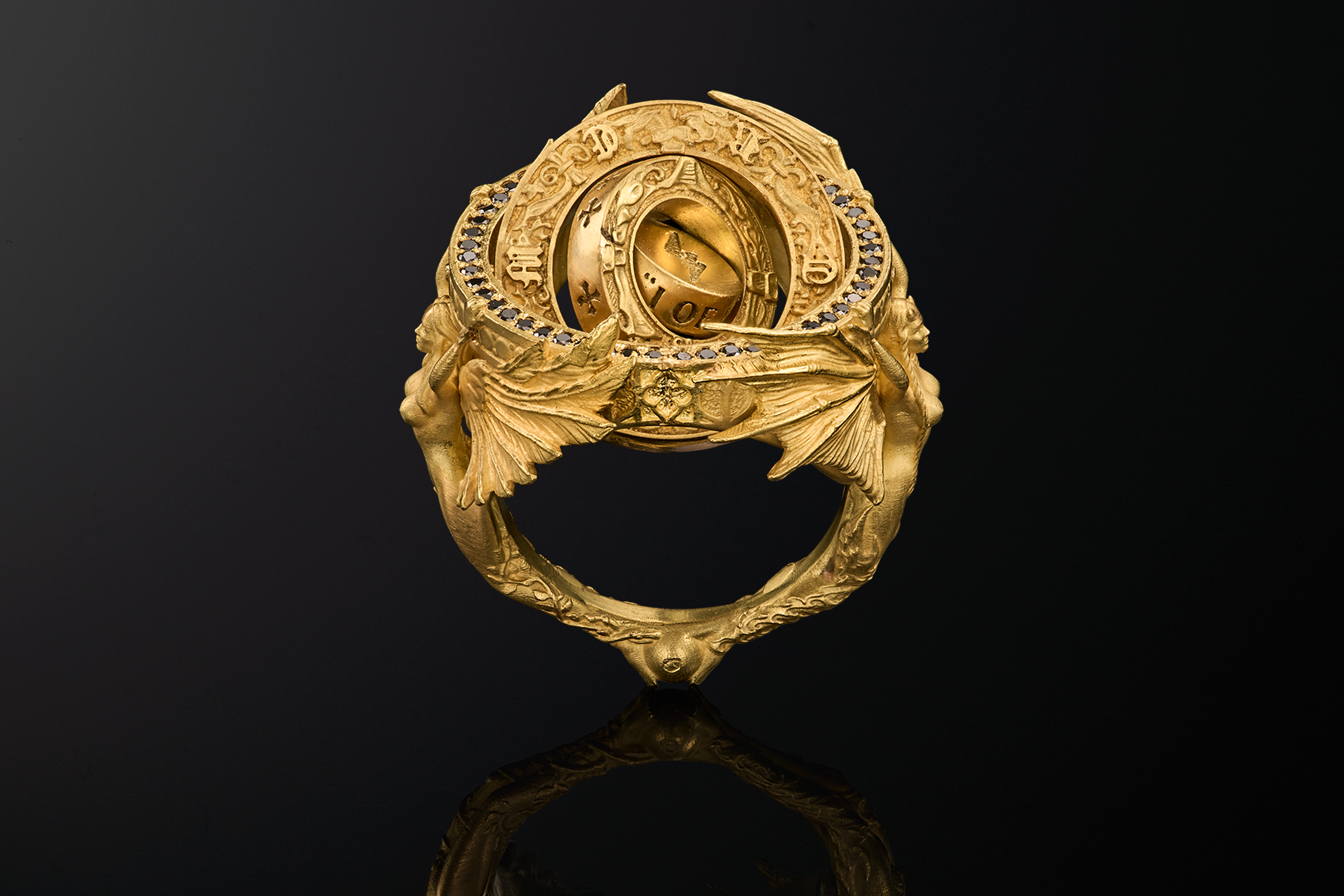 Centered frontal view of the Heaven & Hell ring, showcasing symmetry and multi-layered mechanical construction.
